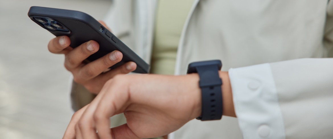 Middle aged woman runner checks her workout performance